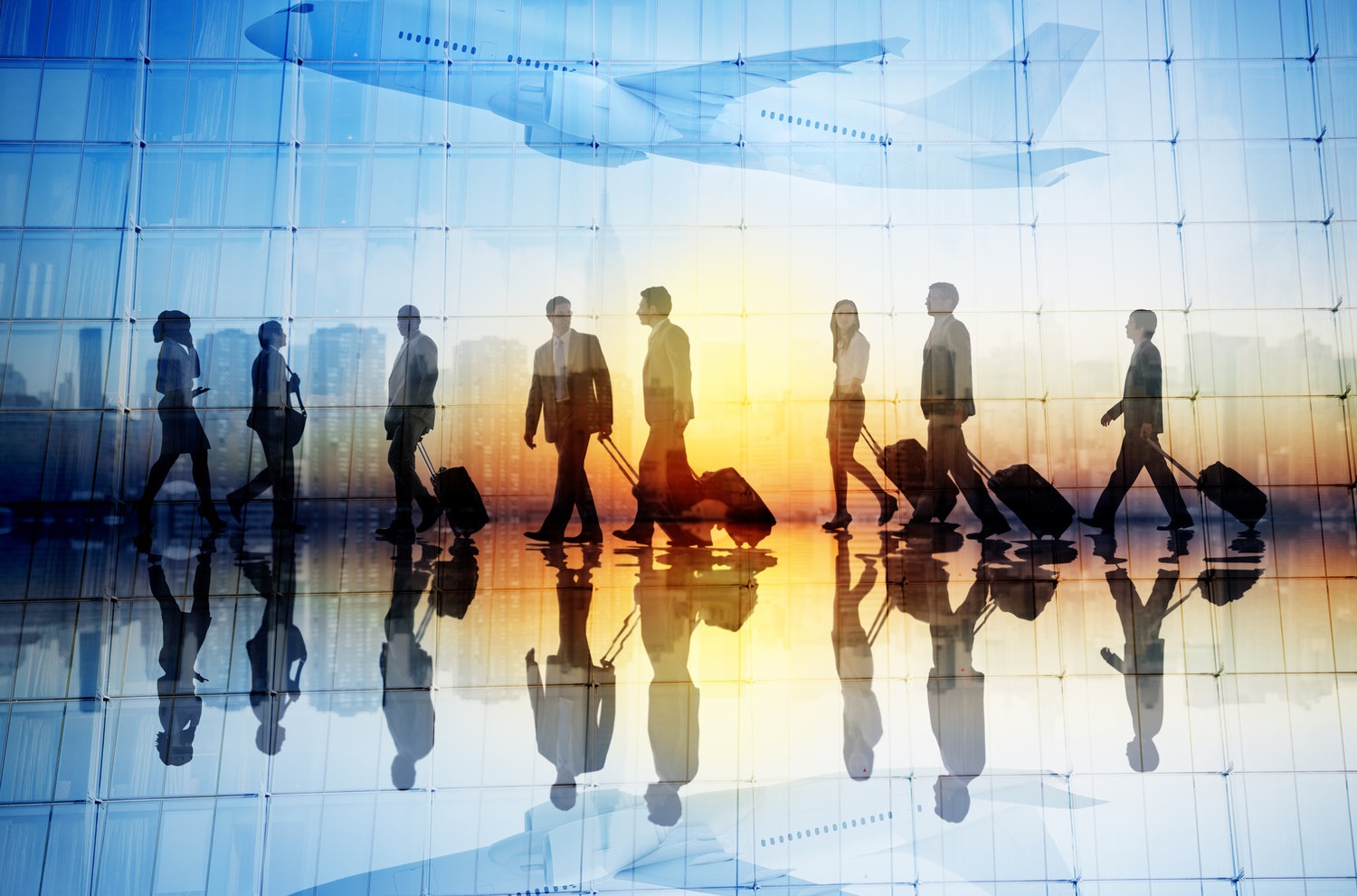 Group of Business Travellers Walking in an Airport